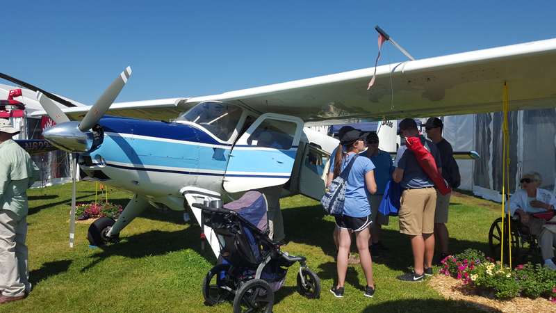 Helio Courier - lousy photo, but I love these planes. Incredible STOL performance. Those leading edge slats drop automatically at low speeds, further reducing stall speed.